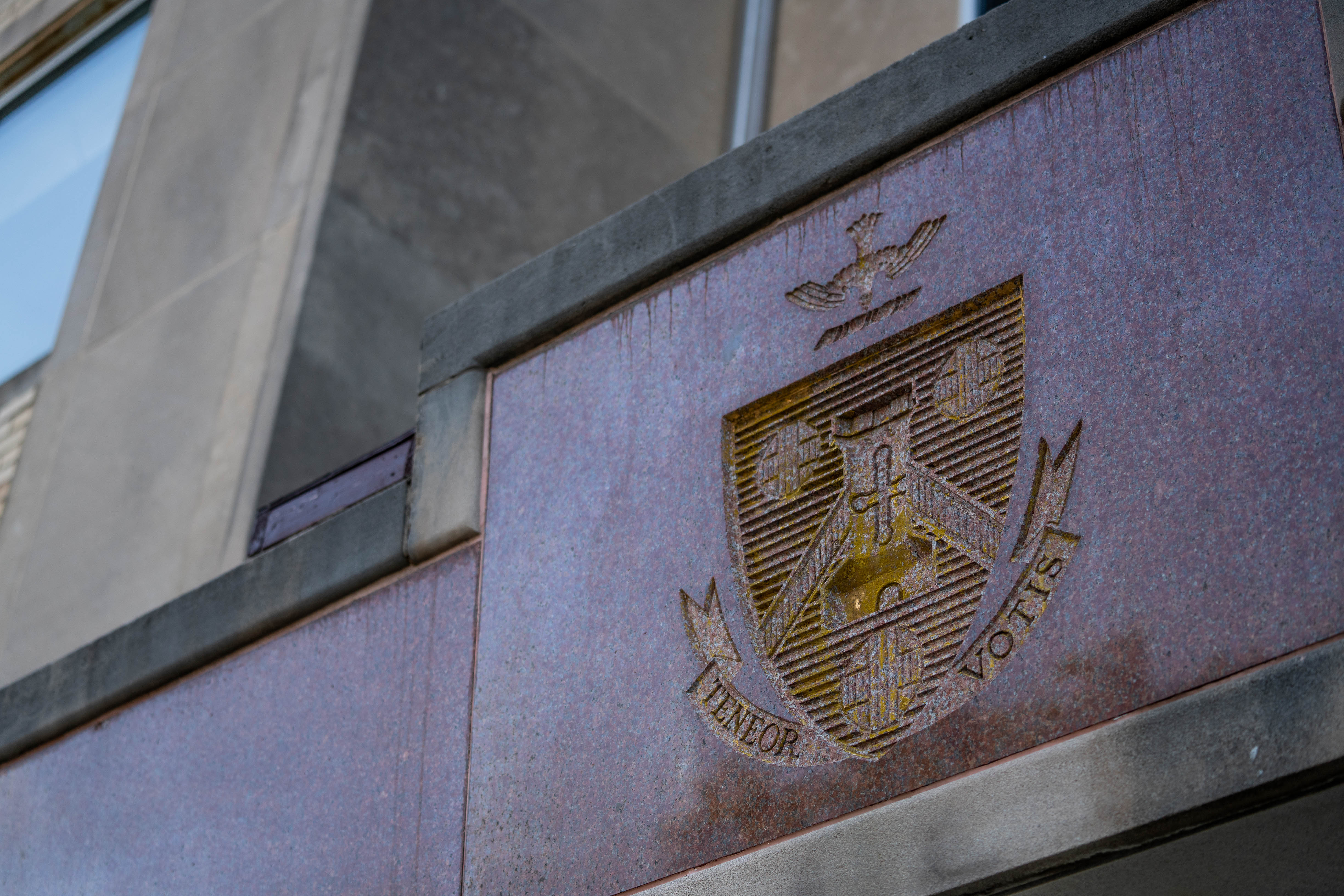 Holy Family University shield with teneor votis motto on Holy Family Hall