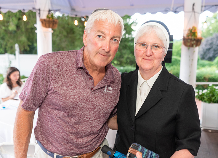 Grand Slam Sponsor Joe Connelly of Landscaping Maintenance & Snow Plowing, Inc. and Sister Rita Fanning, CSFN, ’89, vice president, Mission and Diversity.