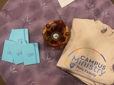 Campus Ministry tshirts and journals on a table