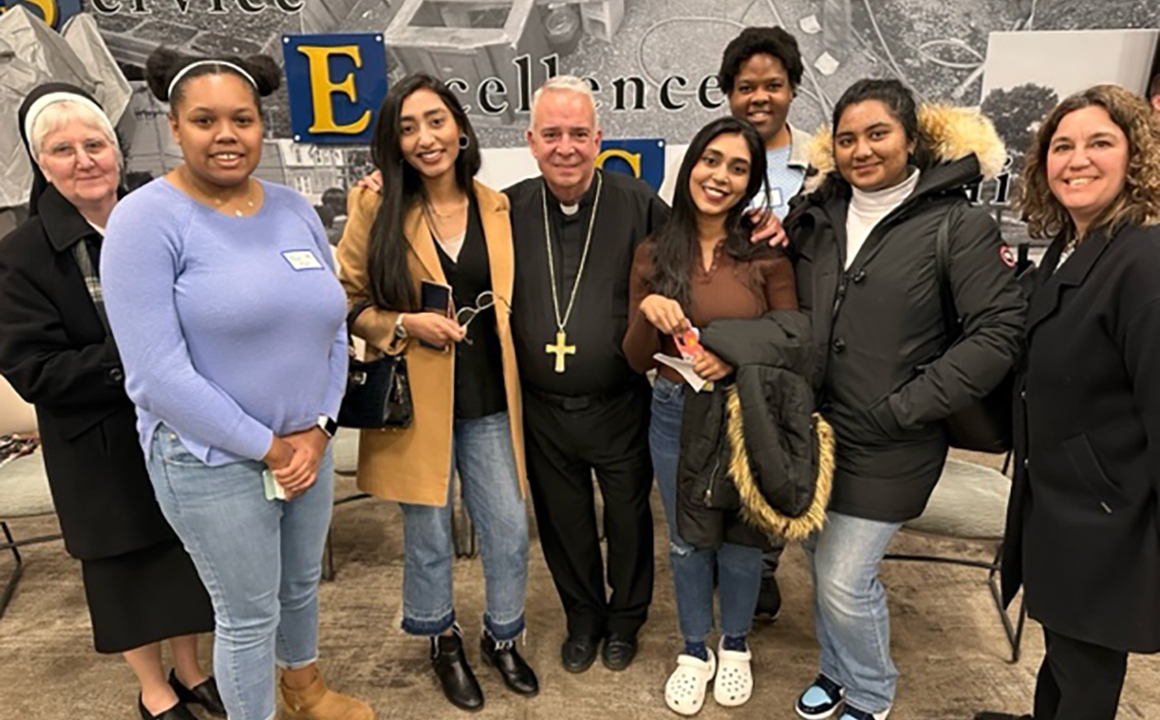 Sister Rita Fanning, CSFN, '89, vice president of Mission and Diversity (far left), Archbishop Nelson J. Pérez (center), and Jill Snyder, director of Campus Ministry (far right), with Holy Family University students Maya Myers, Kawish Sadaqat, Mehwish Sadaqat, Julian Stewart, and Esha Dean at the Synod on Synodality.