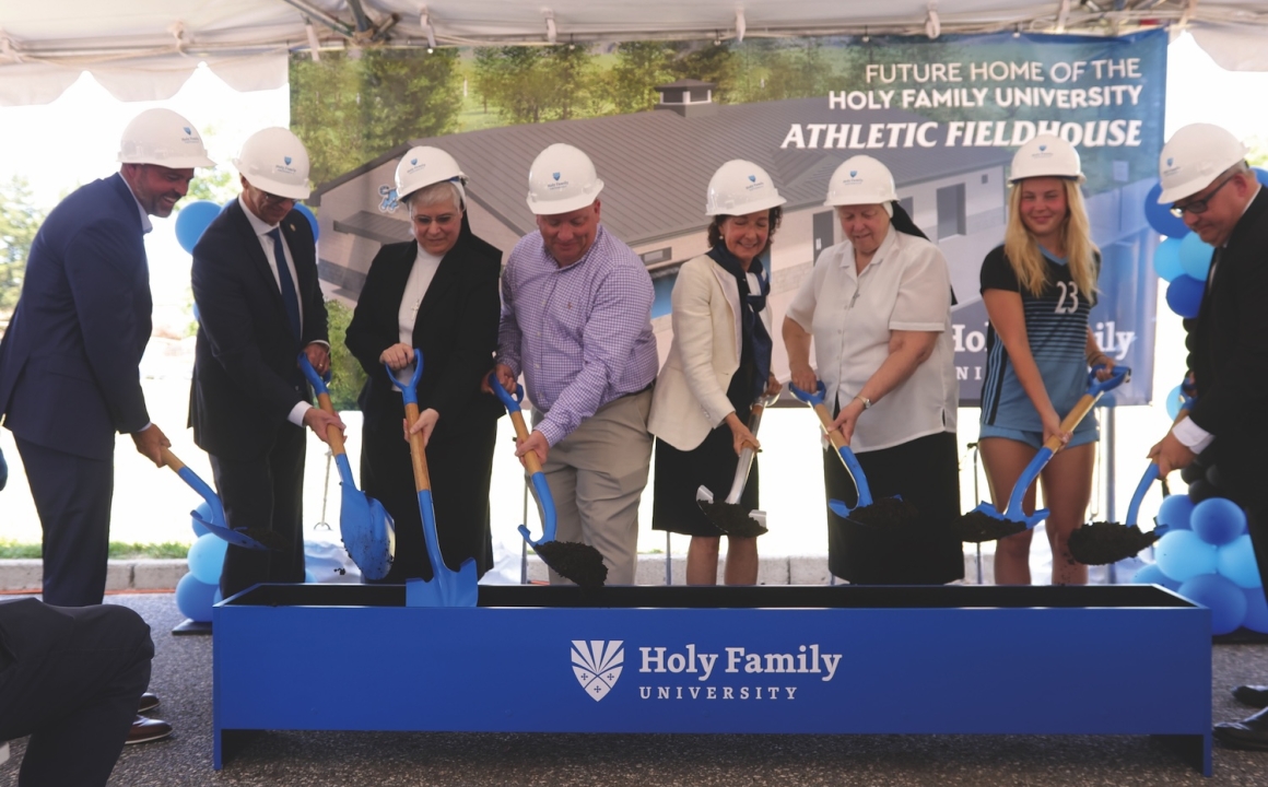 Groundbreaking of new Athletic Fieldhouse - University community members with shovels and hardhats