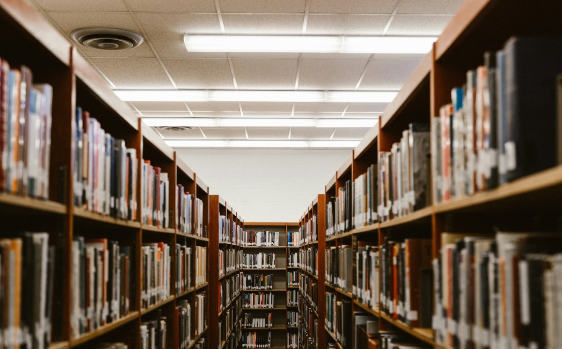 Rows of book shelves in a library