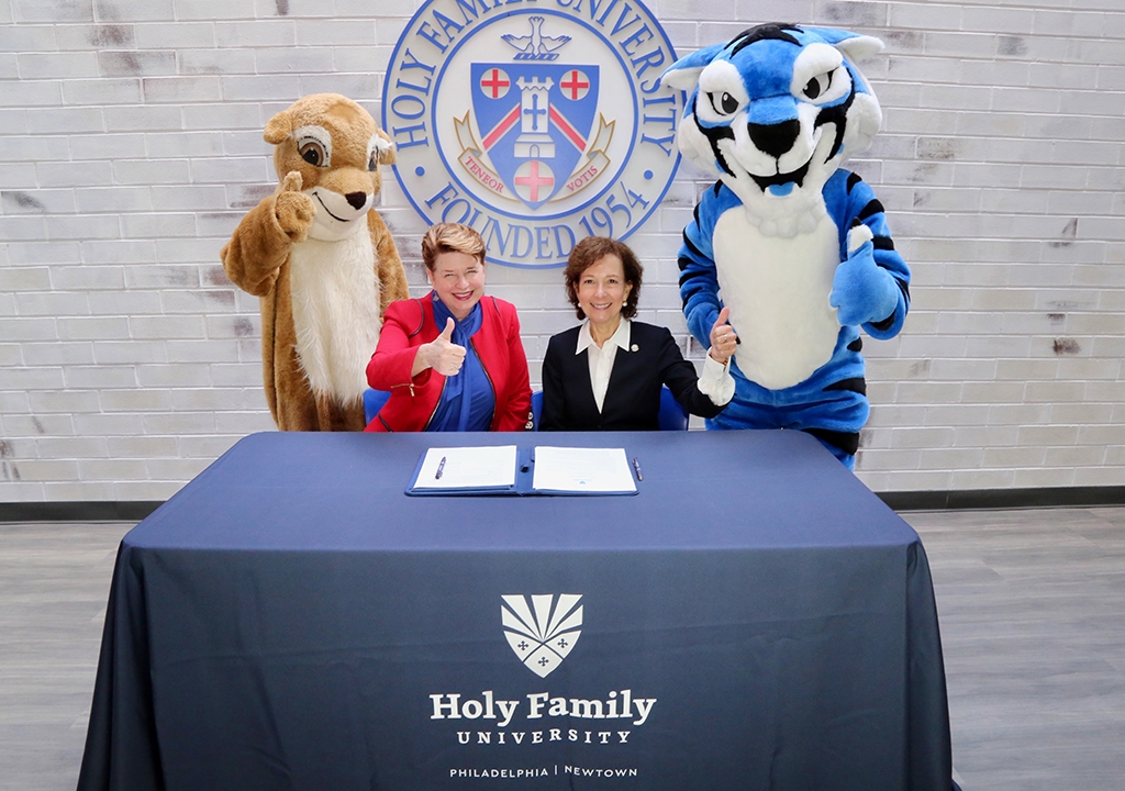 Anne Prisco, Ph.D., President of Holy Family University, and Lizanne Pando, Ed.D., President of St. Hubert Catholic High School For Girls with Mascots