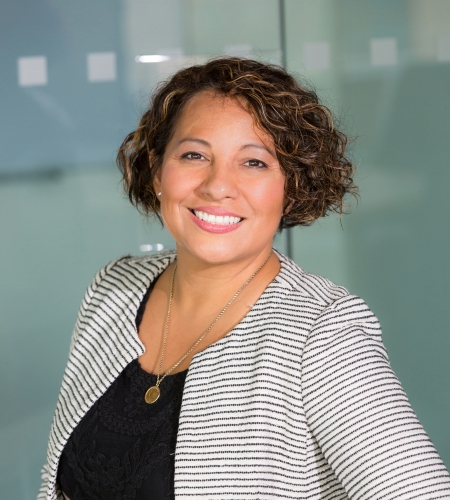 Photo of a woman smiling.