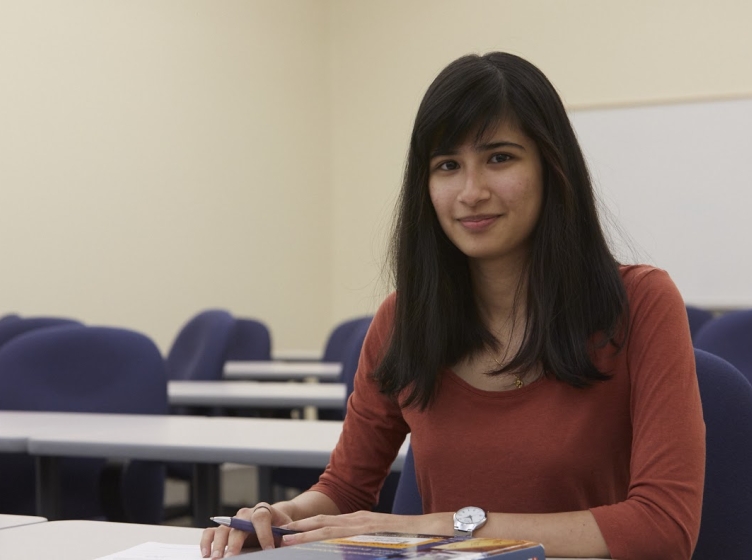 Young student in business class. 