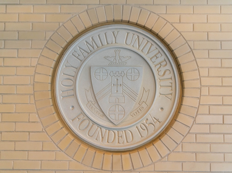 University Seal on brick wall