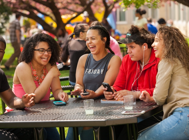 Students Sitting at Table in the Quad