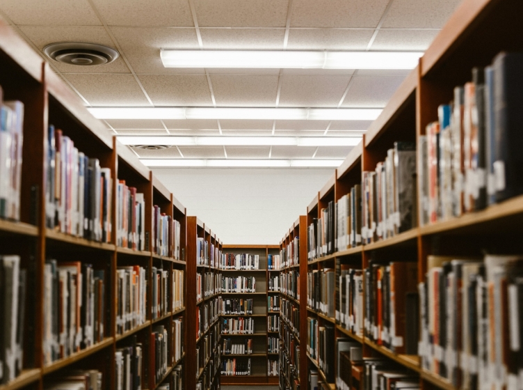 Rows of book shelves in a library