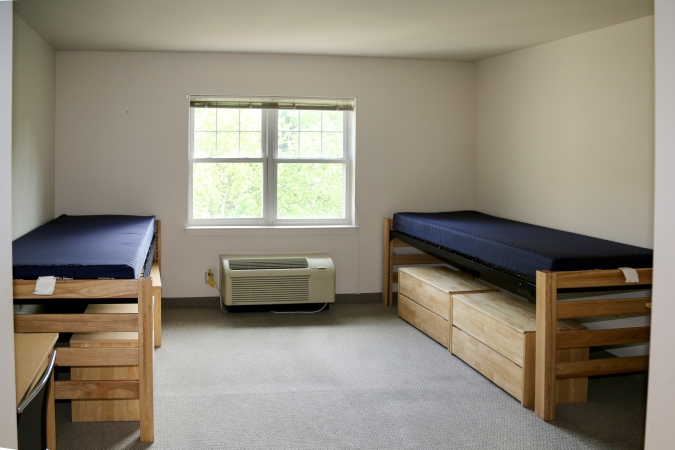 Delaney Hall Residence dorm room with two beds and a large window