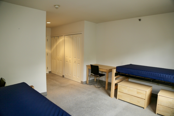 Delaney Hall Residence dorm room showing beds and closets