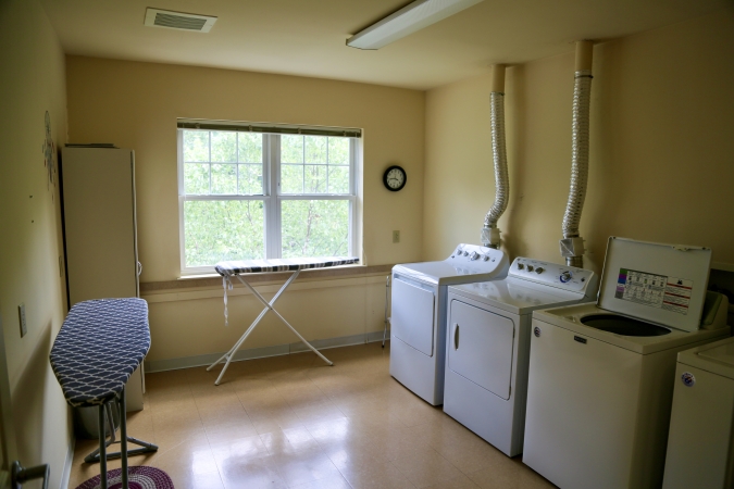 Delaney Hall Residence large shared laundry room with washers and dryers