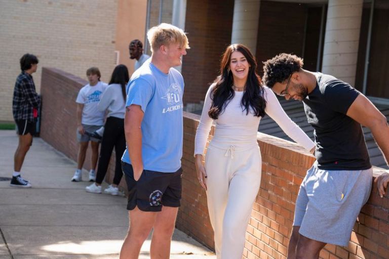 Holy Family University students hanging out and talking outside on campus