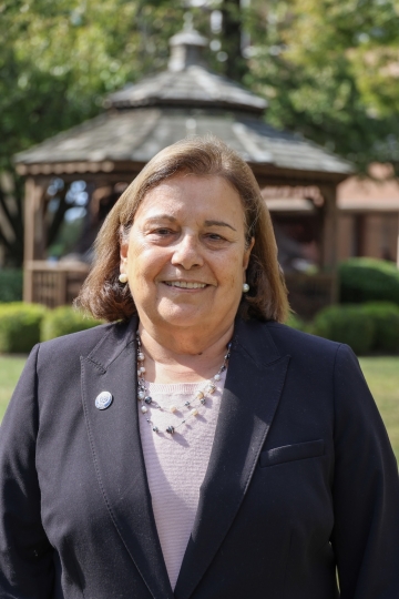 Sylvia McGeary standing in front of HFU's gazebo